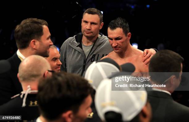 Wladimir Klitschko speaks with his brother Vitali Klitchko after defeat to Anthony Joshua in the IBF, WBA and IBO Heavyweight World Title bout at...