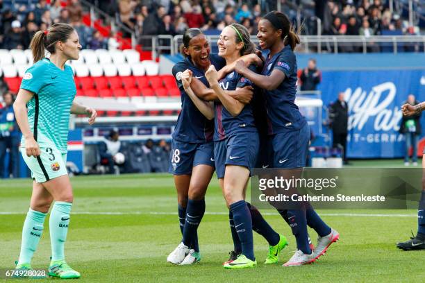 Sabrina Delannoy of Paris Saint-Germain is celebrating her goal from a penalty shot with her teammates Marie-Laure Delie and Grace Geyoro of Paris...