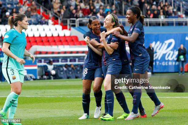 Sabrina Delannoy of Paris Saint-Germain is celebrating her goal from a penalty shot with her teammates Marie-Laure Delie and Grace Geyoro of Paris...