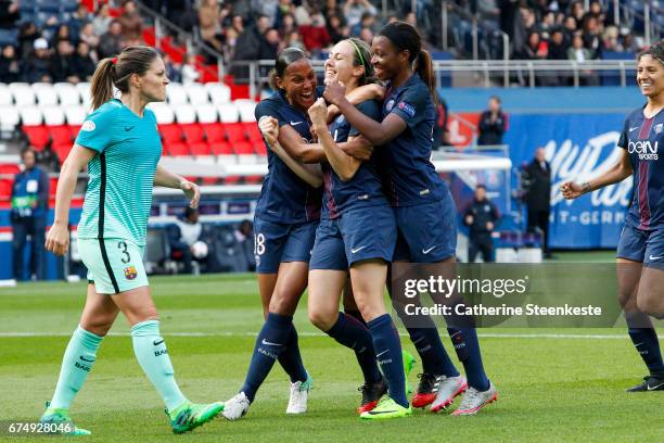 Sabrina Delannoy of Paris Saint-Germain is celebrating her goal from a penalty shot with her teammates Marie-Laure Delie and Grace Geyoro of Paris...