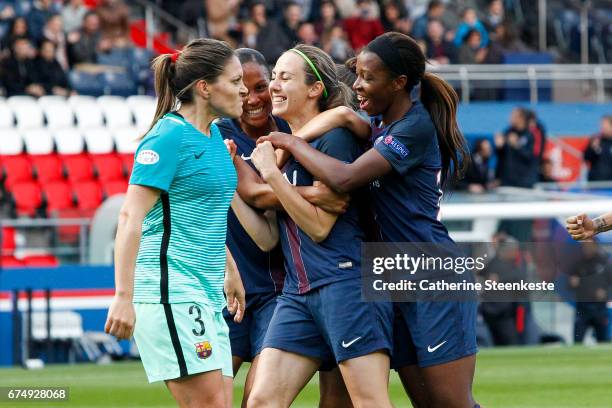 Sabrina Delannoy of Paris Saint-Germain is celebrating her goal from a penalty shot with her teammates Marie-Laure Delie and Grace Geyoro of Paris...