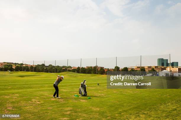 Year-old amateur Eun Jeong Seong of South Korea practices on the driving range after the completion of the third round of the Volunteers of America...