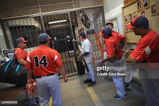 Elliott Smith leads the Club Mexico baseball team in Stockton, California, in to San Quentin State Prison to play baseball on April 29, 2017 in San...