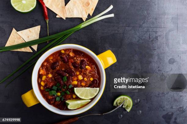 chili con carne stew on rustic table, top view - chili soup stock pictures, royalty-free photos & images