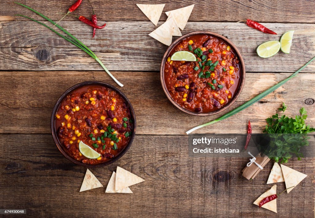 Chili con carne stew served in ceramic bowll