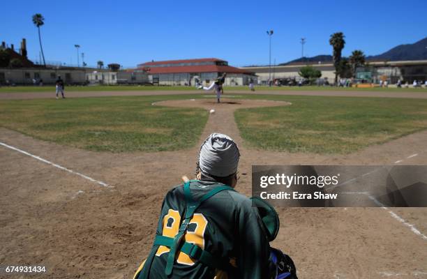 Branden Terrell of the San Quentin Athletics warms up in between inning of their game against the Club Mexico team from Stockton, California on April...