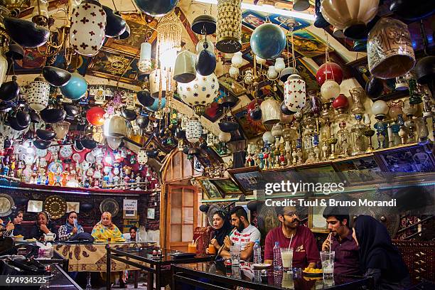 iran, isfahan, azadegan teahouse - pipe smoking women stock pictures, royalty-free photos & images