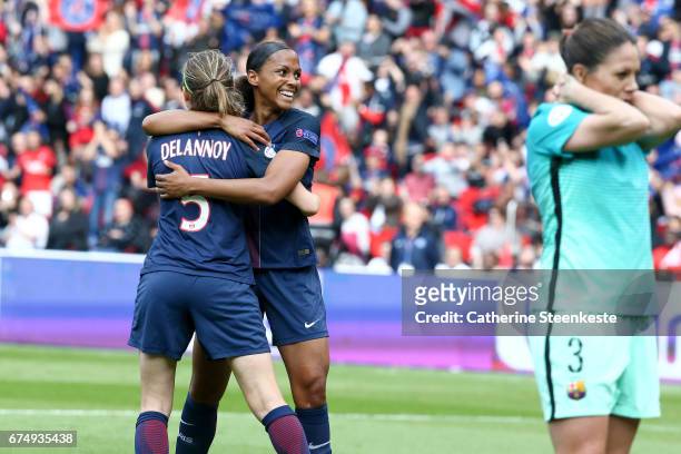 Marie-Laure Delie and Sabrina Delannoy of Paris Saint-Germain are celebrating the second goal of their team during the Women's Champions League match...