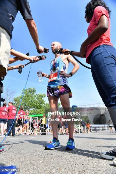 Competitor Scott Wietecha celebrates after finishing the St. Jude Rock 'n' Roll Nashville Marathon on April 29, 2017 in Nashville, Tennessee.