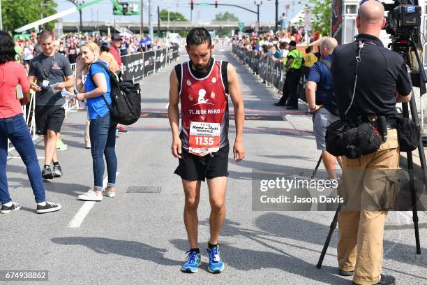 Competitor and St. Judy Hero Edgar Garza finishes the St. Jude Rock 'n' Roll Nashville Marathon on April 29, 2017 in Nashville, Tennessee.