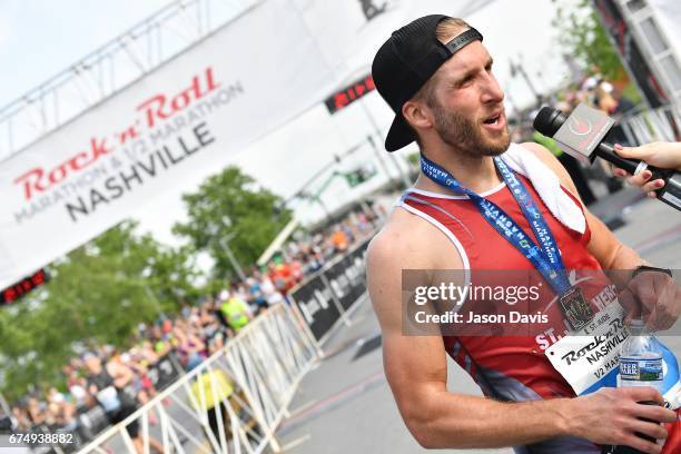 Personality Shawn Booth celebrates after the St. Jude Rock 'n' Roll Nashville Marathon on April 29, 2017 in Nashville, Tennessee.