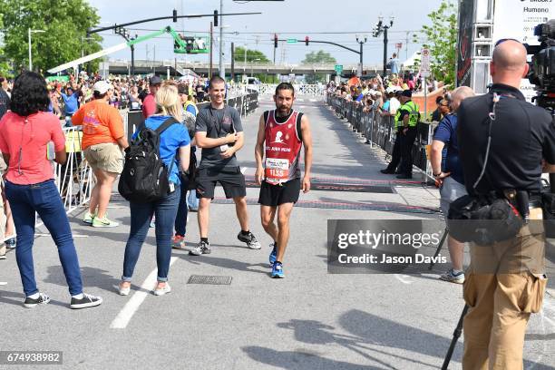 Competitor and St. Judy Hero Edgar Garza finishes the St. Jude Rock 'n' Roll Nashville Marathon on April 29, 2017 in Nashville, Tennessee.