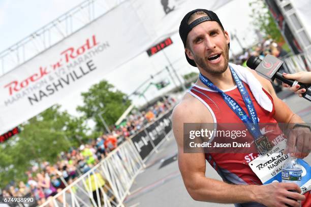 Personality Shawn Booth celebrates after the St. Jude Rock 'n' Roll Nashville Marathon on April 29, 2017 in Nashville, Tennessee.