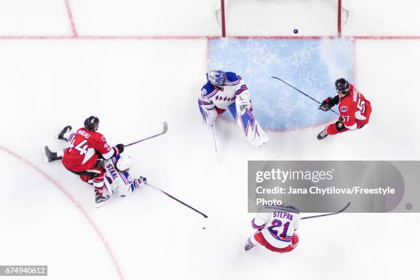 Jean-Gabriel Pageau of the Ottawa Senators scores the overtime goal and his fourth goal of the game as Henrik Lundqvist of the New York Rangers...