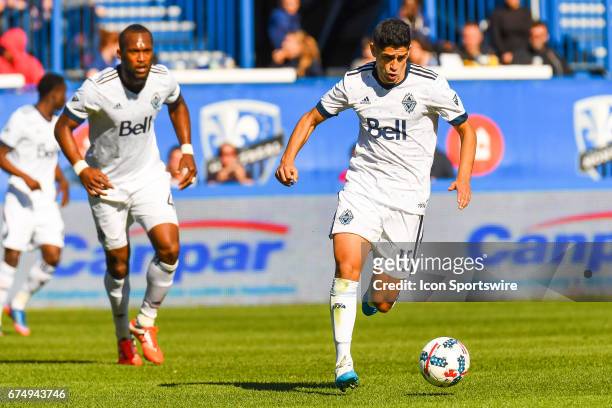 Vancouver Whitecaps midfielder Matias Laba running in control of the ball during the Vancouver Whitecaps FC versus the Montreal Impact game on April...