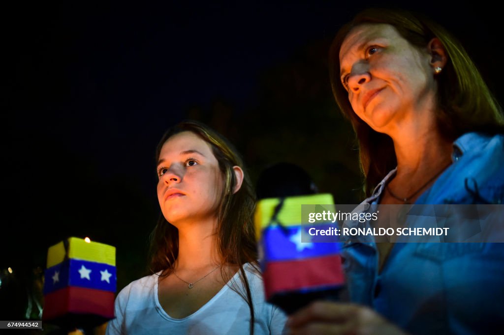 TOPSHOT-VENEZUELA-CRISIS-PROTEST-VICTIM-MARCH