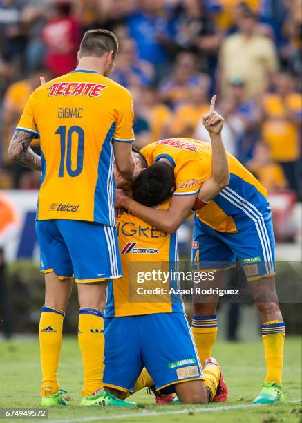 Juninho of Tigres celebrate with teammates Andre Gignac and Hugo Ayala after scoring his team's third goal during the 16th round match between Tigres...