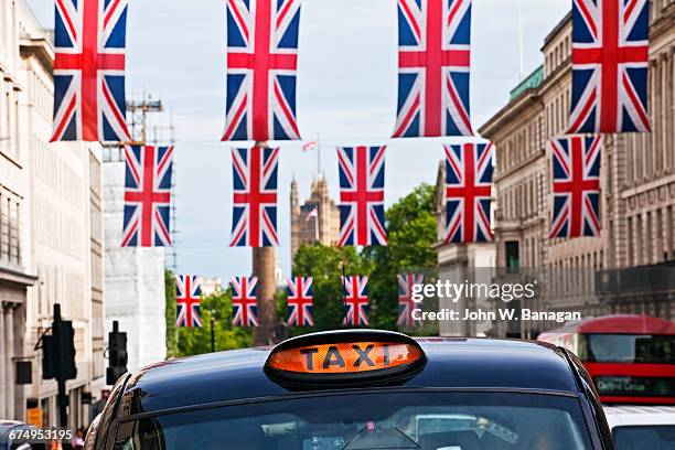 british flags, piccadilly, london - queen royal person ストックフォトと画像