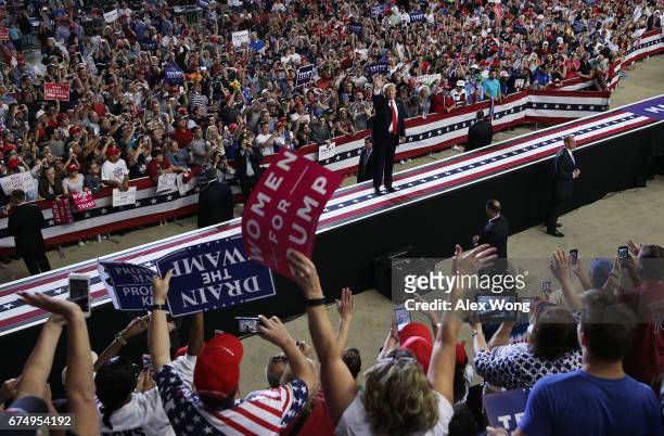 President Donald Trump acknowledges supporters as he leaves after speaking at a "Make America Great Again Rally" at the Pennsylvania Farm Show...