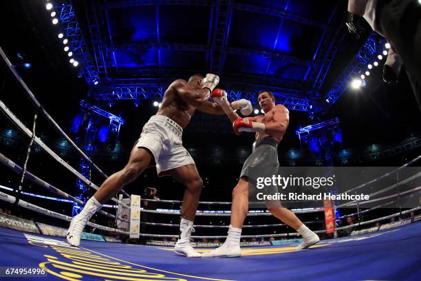 Anthony Joshua and Wladimir Klitschko in action during the IBF, WBA and IBO Heavyweight World Title bout at Wembley Stadium on April 29, 2017 in...