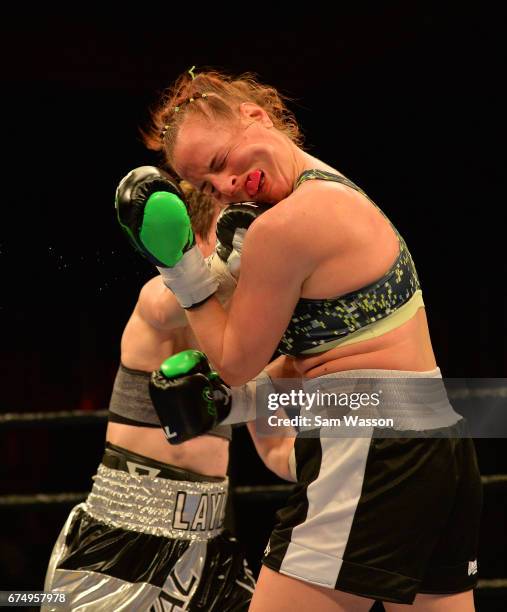 Layla McCarter lands a right on Szilvia Szabados during their welterweight fight at Sam's Town Hotel & Gambling Hall on April 29, 2017 in Las Vegas,...