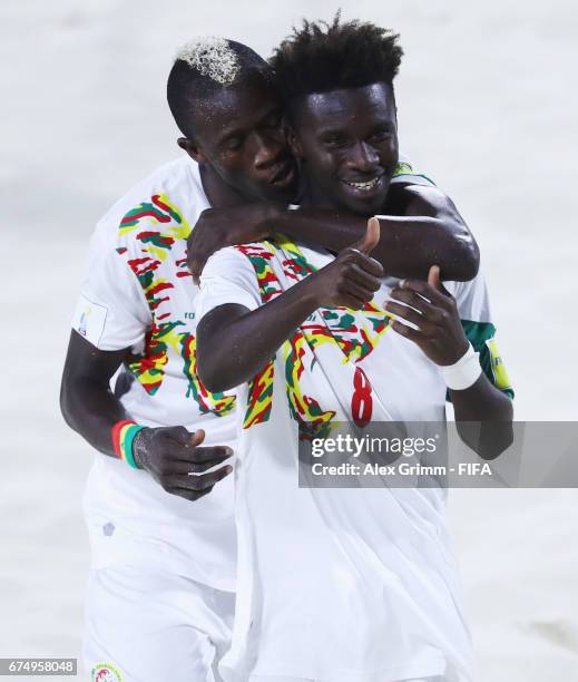 Hamad Diouf of Senegal celebrates a goal with team mate Ibrahima Balde during the FIFA Beach Soccer World Cup Bahamas 2017 group A match between...