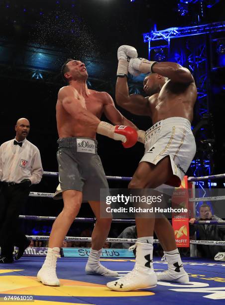 Anthony Joshua and Wladimir Klitschko in action during the IBF, WBA and IBO Heavyweight World Title bout at Wembley Stadium on April 29, 2017 in...