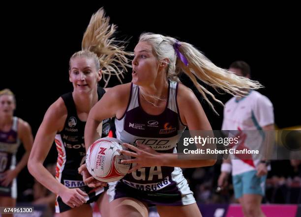 Gretel Tippett of the Firebirds looks to pass the ball during the round 10 Super Netball match between the Magpies and the Firebirds at the...