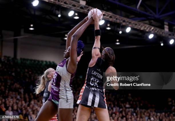Romelda Aiken of the Firebirds is challenged by Sharni Layton of the Magpies during the round 10 Super Netball match between the Magpies and the...