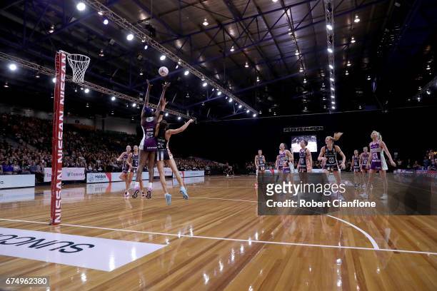 Romelda Aiken of the Firebirds is challenged by Sharni Layton of the Magpies during the round 10 Super Netball match between the Magpies and the...