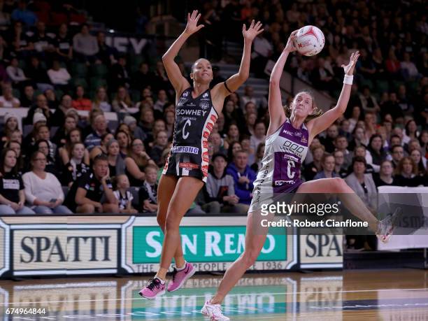 Erin Burger of the Firebirds gets the ball ahead of Kim Ravaillion of the Magpies during the round 10 Super Netball match between the Magpies and the...