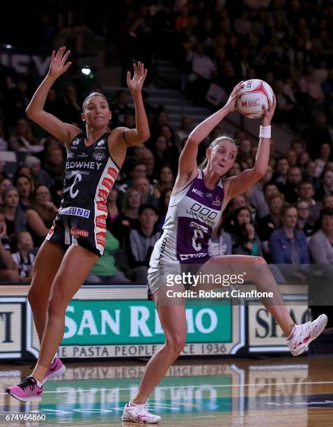 Erin Burger of the Firebirds gets the ball ahead of Kim Ravaillion of the Magpies during the round 10 Super Netball match between the Magpies and the...