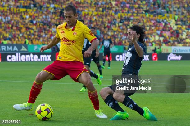 Emanuel Loeschbor of Morelia and Matias Britos of Pumas fight for the ball during the 16th round match between Morelia and Pumas as part of the...