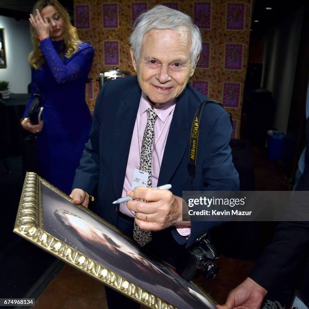 Set Photographer Steve Schapiro signs his portrait of Marlon Brando at "The Godfather" 45th Anniversary Screening during 2017 Tribeca Film Festival...