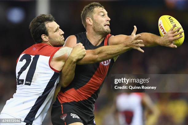 Cameron Pedersen of the Demons and Tom Bellchambers of the Bombers compete in the ruck during the round six AFL match between the Essendon Bombers...