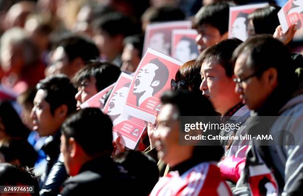 Fans from Japan hold up pictures of Maya Yoshida of Southampton during the Premier League match between Southampton and Hull City at St Mary's...