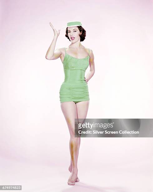 American actress and dancer Cyd Charisse in a green swimsuit, circa 1950.