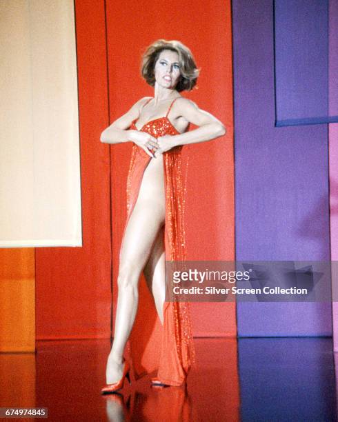 American actress and dancer Cyd Charisse as Sarita in the opening sequence of the spy spoof 'The Silencers', 1966.