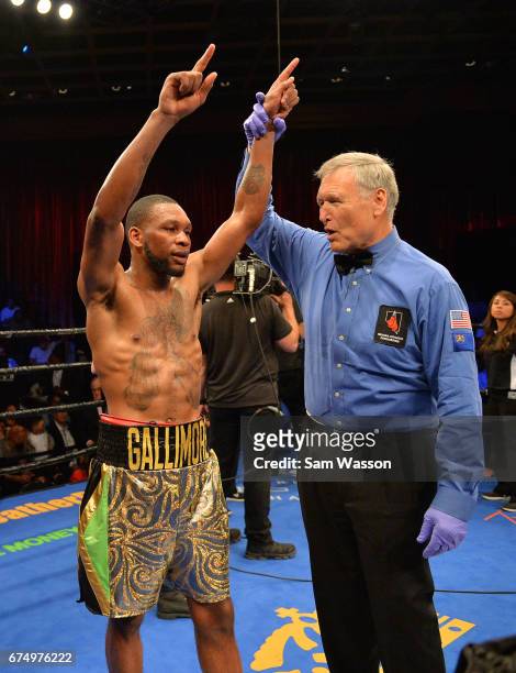 Referee Jay Nady raises Nathaniel Gallimore's arm after he defeated Jeison Rosario in their middleweight fight at Sam's Town Hotel & Gambling Hall on...