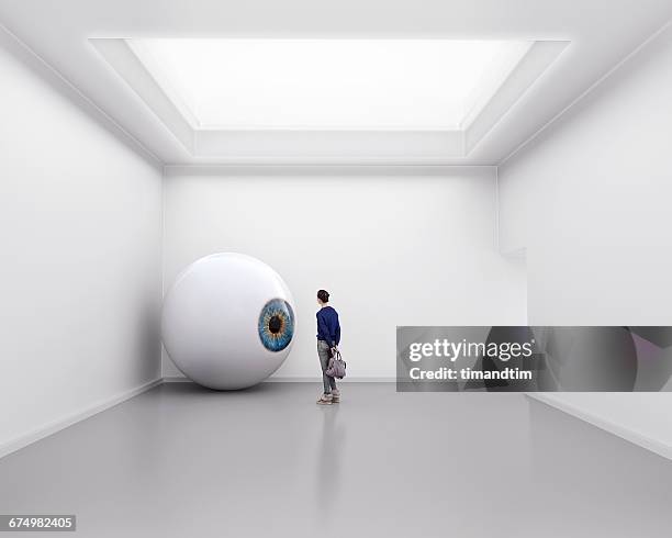 giant eye in gallery room - big ideas stock pictures, royalty-free photos & images