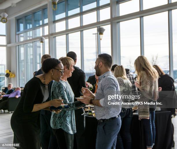 people socialize at conference meeting/luncheon - indian buffet stock pictures, royalty-free photos & images