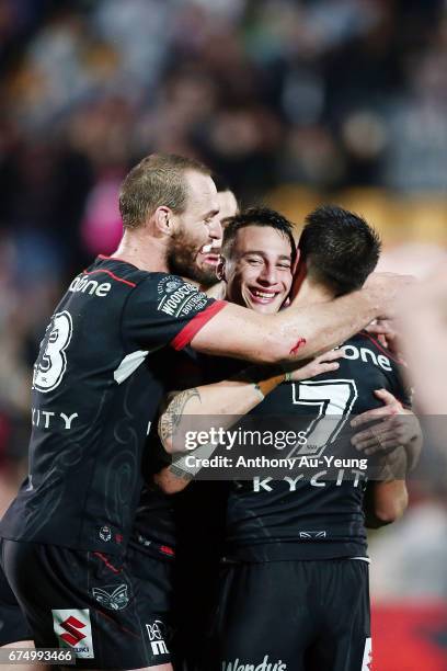 Charnze Nicoll-Klokstad of the Warriors celebrates with teammates Shaun Johnson, Simon Mannering and Ben Matulino after winning the round nine NRL...