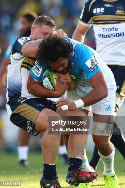 Steven Luatua of the Blues is tackled during the round 10 Super Rugby match between the Brumbies and the Blues at GIO Stadium on April 30, 2017 in...