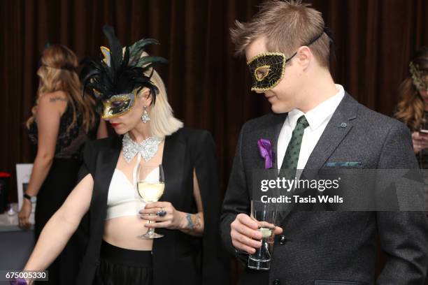 Actors Lucas Gabreel and Emily Morris attend the Unmasque Cancer Masquerade benefit supporting young adult cancer survivors at The Mark for Events on...