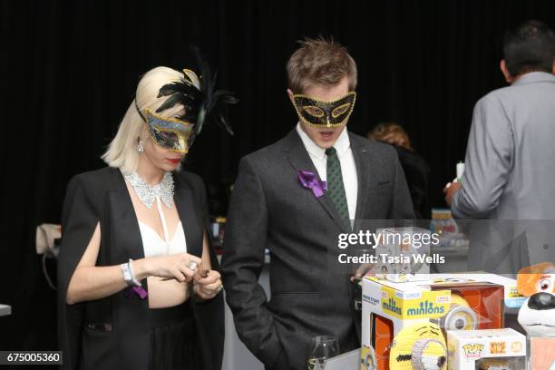 Actors Lucas Gabreel and Emily Morris attend the Unmasque Cancer Masquerade benefit supporting young adult cancer survivors at The Mark for Events on...
