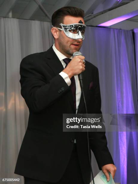 Actor Jesse Jensen speaks onstage at the Unmasque Cancer Masquerade benefit supporting young adult cancer survivors at The Mark for Events on April...