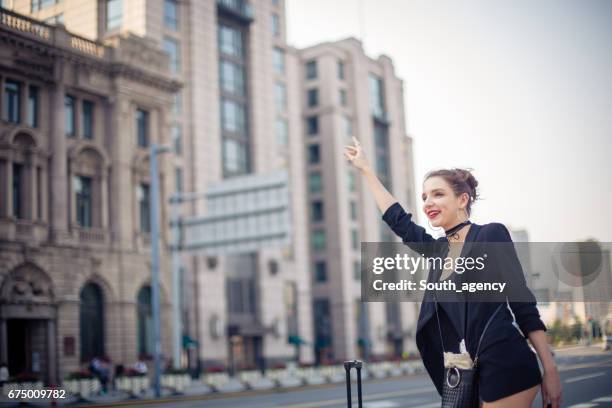 calling a cab - shanghai taxi stock pictures, royalty-free photos & images