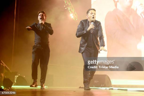 Freddy Maerz and Martin Marcell of the band Fantasy perform during 'Die Schlagernacht des Jahres' at Lanxess Arena on April 29, 2017 in Cologne,...