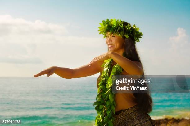 hawaiian hula dancer dancing on the beach - hawaiian print dress stock pictures, royalty-free photos & images