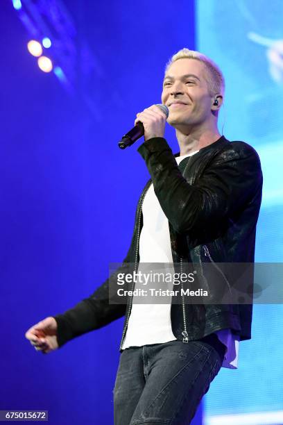 German singer Julian David performs during 'Die Schlagernacht des Jahres' at Lanxess Arena on April 29, 2017 in Cologne, Germany.